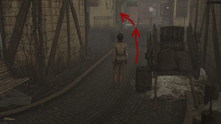 Wyjdź na zewnątrz i skieruj się w prawo, a dotarłszy do przecznicy, wędruj w lewo i idź cały czas przed siebie, tak jak prowadzi droga - na samym końcu uliczki wejdź po schodkach - Znajdź Simona Steinera, rzemieślnika | Rozdział trzeci | Solucja Syberia 3 - Syberia 3 - poradnik do gry