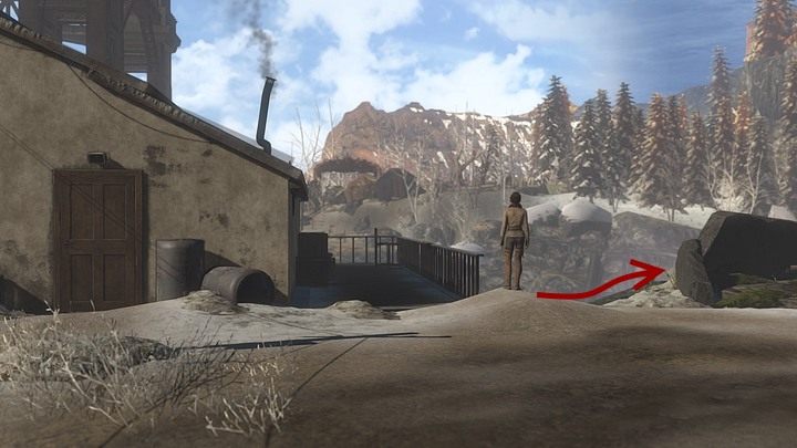 Minąwszy go, skieruj się nad urwisty brzeg rzeki - trzeba obejść od lewej miejsce z przypominającą piec z czterema kominami konstrukcją otoczoną ciemnymi głazami - Odszukaj strażnika po drugiej stronie rzeki | Opis przejścia Syberia 3 - Syberia 3 - poradnik do gry