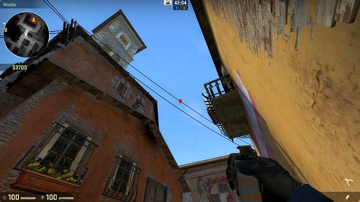 Ustaw się w rogu budynku i wyceluj w oznaczony na obrazku punkt znajdujący się dokładnie na linii wysokiego napięcia - Inferno | Mapy turniejowe | CS GO - CS GO - poradnik do gry