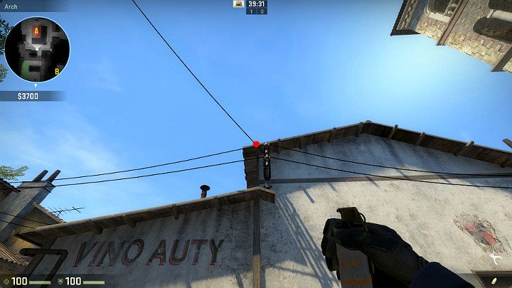 Ustaw się w wyznaczonym miejscu i wyceluj w oznaczony punkt, który znajduje się na przecięciu się kabla z dachem - Inferno | Mapy turniejowe | CS GO - CS GO - poradnik do gry