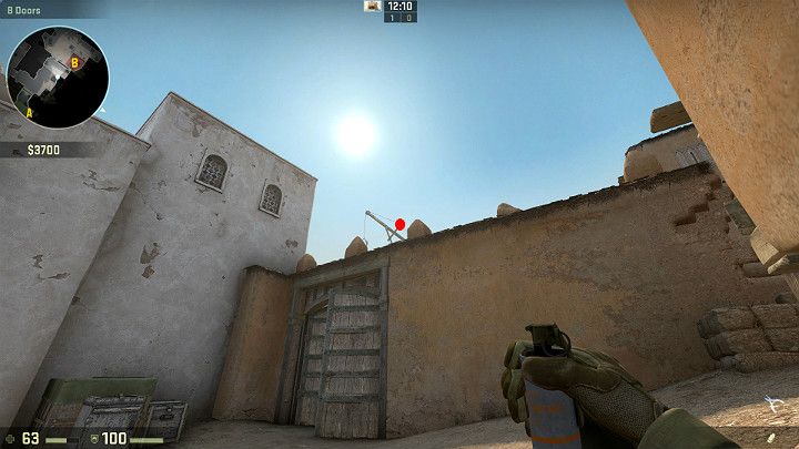 Przed wejściem na punkt podłożenia Bomby B jesteś w stanie wrzucić granat dymny do tunelu od strony Terrorystów - Dust 2 | Mapy Turniejowe | CS GO - CS GO - poradnik do gry
