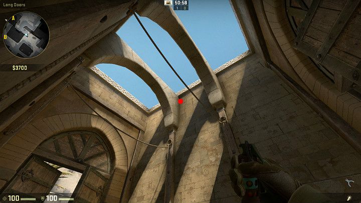 W tunelu pomiędzy stroną Terrorystów, a Antyterrorystów ustaw się w rogu i wyceluj w miejsce zaznaczone na powyższym obrazku - Dust 2 | Mapy Turniejowe | CS GO - CS GO - poradnik do gry