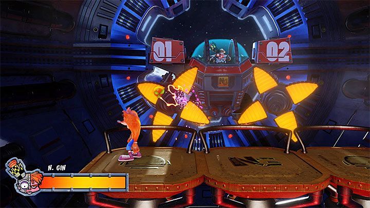 Przez całą bitwę do atakowania bossa musisz używać jabłek - Dr. Nitrus Gin | Crash Bandicoot 2 | Walki z bossami - Crash Bandicoot N. Sane Trilogy - poradnik do gry
