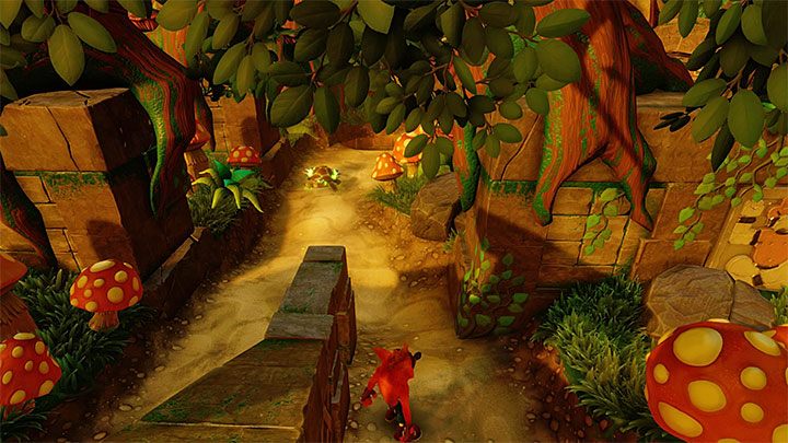 Powróć do wspomnianego wyżej rozwidlenia i teraz dla odmiany wybierz niezbadaną jeszcze prawą ścieżkę - The Pits | Jungle Warp Room | Opis przyjścia | Crash Bandicoot N. Sane Trilogy - Crash Bandicoot N. Sane Trilogy - poradnik do gry