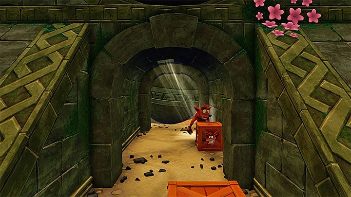 Zaliczenie tego etapu tylko na pierwszy rzut oka wydaje się trudne, gdyż Crash nie zostanie od razu zmiażdżony przez głaz nawet jeśli gdzieś na (krótką) chwilkę zwolnisz - Boulders | Crash Bandicoot - N. Sanity Island - Crash Bandicoot N. Sane Trilogy - poradnik do gry