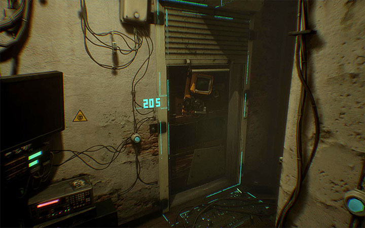 Przejdź pod roletą żeby dostać się do mieszkania 205 - Odblokowanie sprawy i zbadanie mieszkania 205 | Opis przejścia Observer - Observer - poradnik do gry