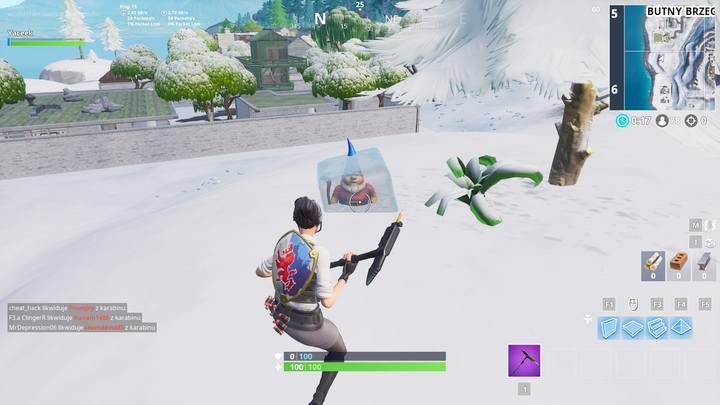 Drugi gnom znajduje się na południe od Butnego Brzegu, zaraz obok niewielkiego drzewa - Wyzwanie Fortnite - Przeszukaj zimne gnomy - Fortnite: Battle Royale - poradnik do gry