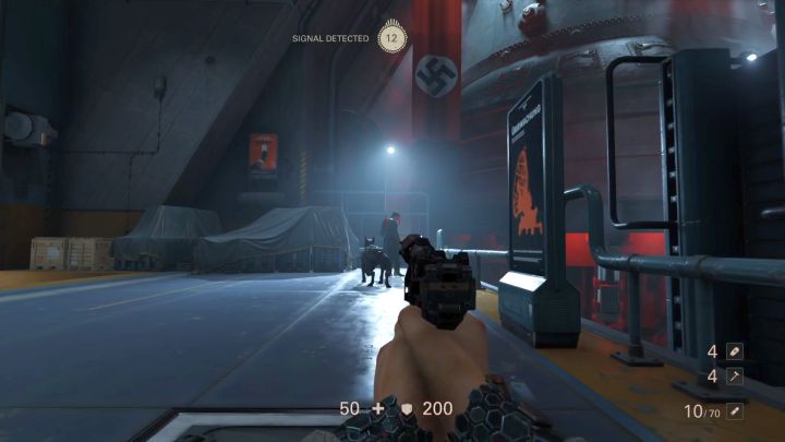 Koło drugiego Dowódcy kręci się pies, który może cię łatwo wywęszyć. - Winda i hangar | Roswell | Solucja Wolfenstein II: The New Colossus - Wolfenstein II: The New Colossus - poradnik do gry