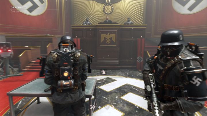 Gdy na ekranie pojawi się stosowna informacja, wykorzystaj atak wręcz, by się uwolnić. - Sąd | Potwór | Solucja Wolfenstein II: The New Colossus - Wolfenstein II: The New Colossus - poradnik do gry