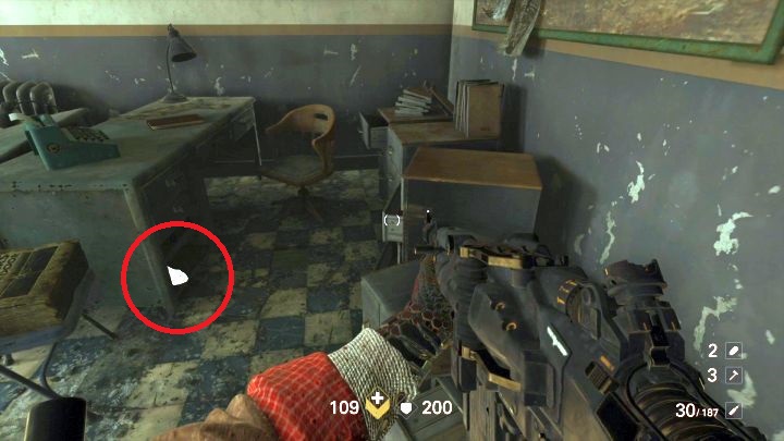 Złoto #6 leżące pod biurkiem na posterunku policji. - Centrum - Sekrety i znajdźki | Sekrety Wolfenstein II - Wolfenstein II: The New Colossus - poradnik do gry