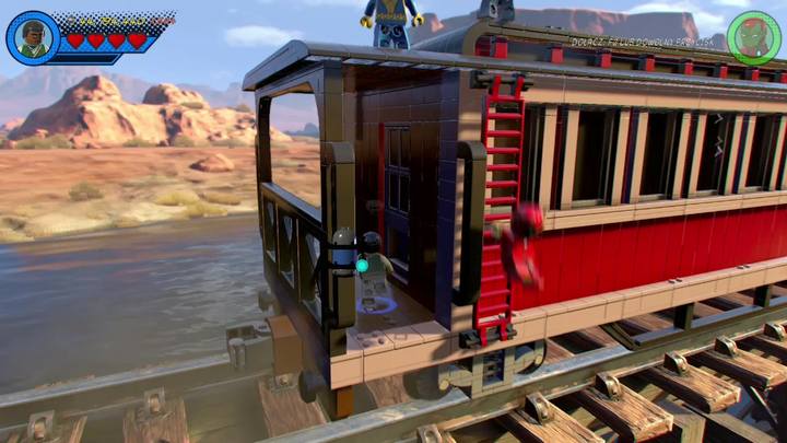 Zaraz pod pierwszym zestawem balonów, czyli na początku pociągu, znajdziesz drabinkę prowadzącą na dół - Sekrety Misja 6 - O kurczę | LEGO Marvel Super Heroes 2 - LEGO Marvel Super Heroes 2 - poradnik do gry