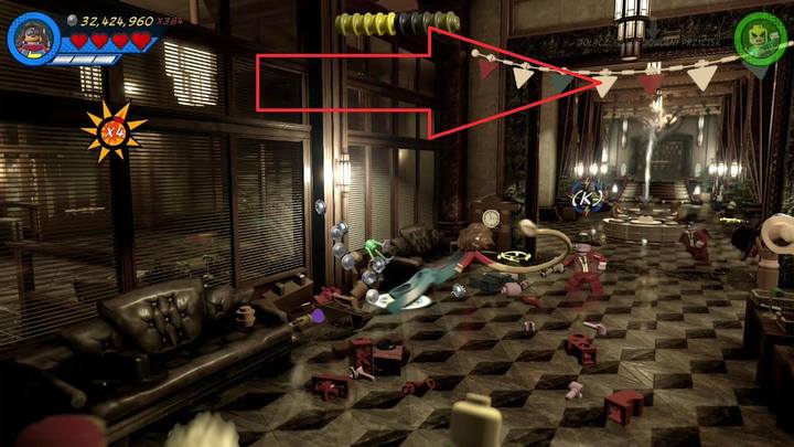 Trzeci obiekt znajdziesz w holu prowadzącym do Hammerheada, w miejscu oznaczonym czerwoną strzałką - Sekrety Misja 9 - Czarno na białym | LEGO Marvel Super Heroes 2 - LEGO Marvel Super Heroes 2 - poradnik do gry