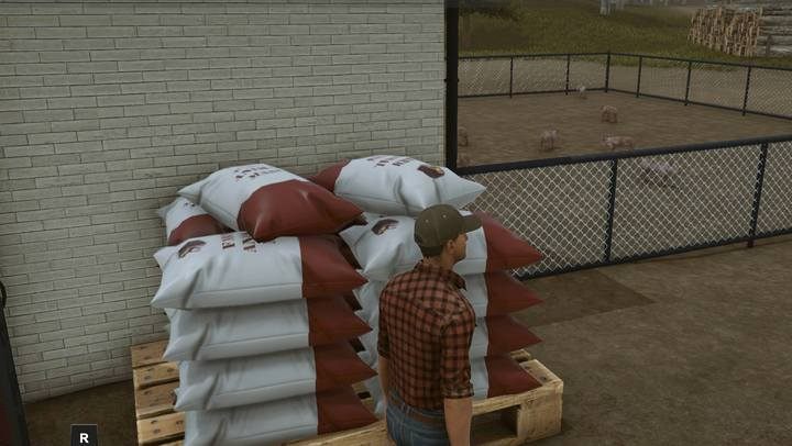 Paszę syntetyczną zakupisz z worków przy chlewni - Hodowla bydła i trzody w Pure Farming 2018 - Pure Farming 2018 - poradnik do gry