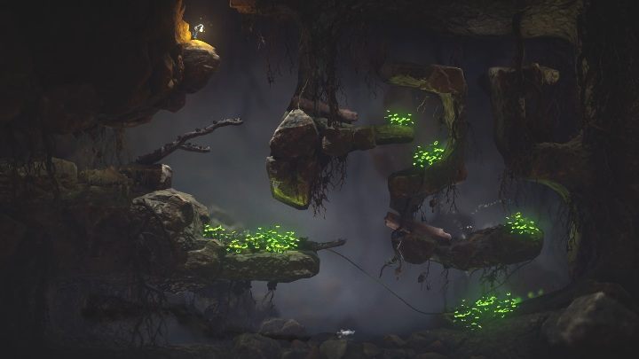 Aby wydostać się z jaskini zeskocz zielonym bohaterem na sam dół i przebiegnij na gałąź po drugiej stronie - Poziom 3 - Little Frogs | Solucja - Unravel 2 - poradnik do gry