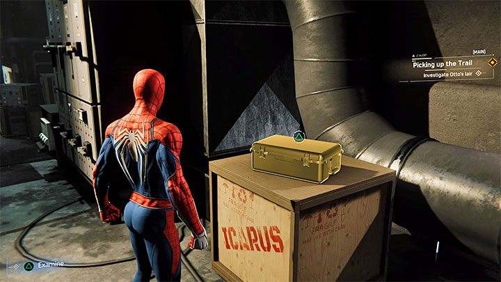 Po oględzinach, podejdźcie do walizki położonej na skrzyni z napisem Icarus - Marvels Spider-Man: Podążanie za śladem (Picking up the Trail) - solucja, opis przejścia - Marvels Spider-Man - poradnik do gry
