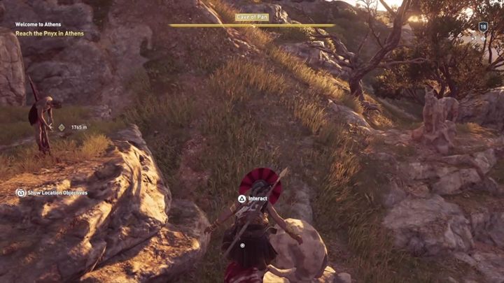 Rozwiązanie zagadki: Jaskinia Pana - statua zakrwawionej kozy przed wejściem do jaskini - Enigmatyczne ostrakony - Attyka - Assassins Creed Odyssey - poradnik do gry