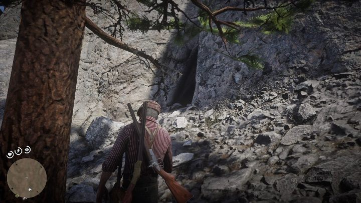 Za drzewem znajduje się wejście do jaskini - Red Dead Redemption 2: Zagadka z dziwnymi posągami, porady - Red Dead Redemption 2 - poradnik do gry