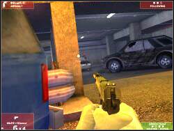 Ostatni terrorysta stojący jeszcze wewnątrz tunelu znajduje się pomiędzy widocznymi na screenie samochodami - Zadanie 3 - OPIS PRZEJŚCIA - Tom Clancys Rainbow Six 3: Raven Shield - poradnik do gry