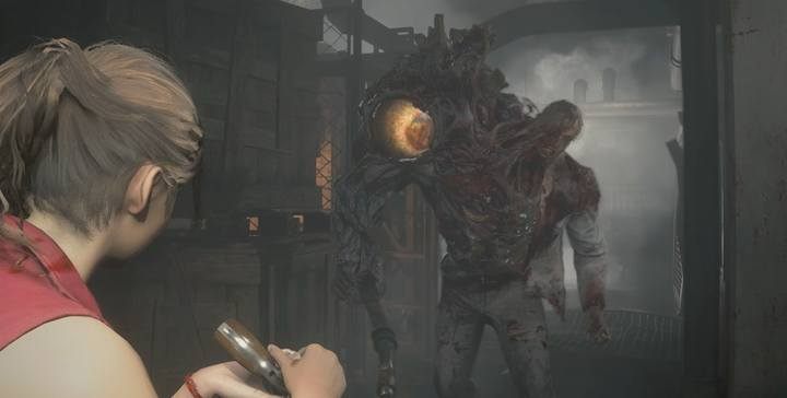 Celuj w duże żółte oko - to jedyne miejsce, które powoduje osłabienie przeciwnika - Podziemia i pierwszy boss | Posterunek policji w Resident Evil 2 - Resident Evil 2 - poradnik do gry