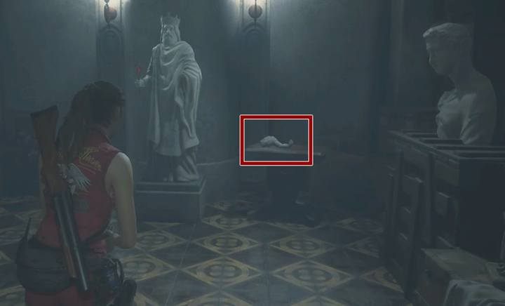 Umieść książkę wraz z ręką w pomniku - Jak zdobyć trzecią broń w Zbrojowni? | Sekrety na Posterunku Policji - Resident Evil 2 - poradnik do gry
