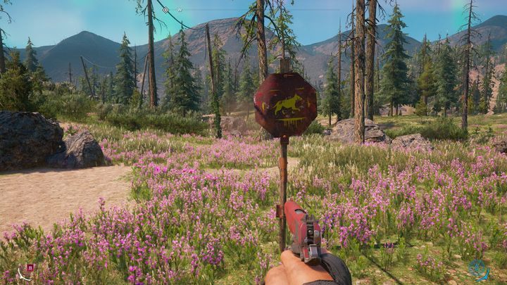Znak drogowi informujący o siedlisku dzikich psów znajdujących się w okolicy. - Łowiectwo w Far Cry New Dawn - Far Cry New Dawn - poradnik do gry