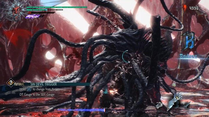 Na początku walki jesteś przemieniony w swoją potężniejszą formę, więc wykorzystaj czas, szybko zaatakuj Urizena i postaraj mu się odebrać jak najwięcej zdrowia - Urizen (Misja 12) - Boss w Devil May Cry 5 - Devil May Cry 5 - poradnik do gry