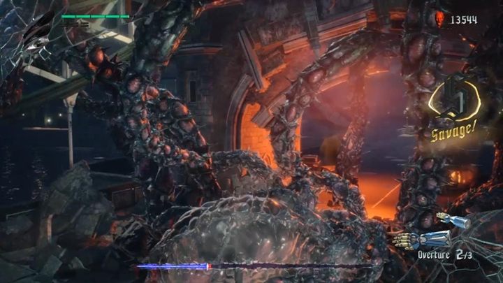 W tle, wróg będzie atakował cię potężnymi mackami, jednak są one bardzo powolne i łatwo można uniknąć ataku - Korzeń Klifota - Boss w Devil May Cry 5 - Devil May Cry 5 - poradnik do gry