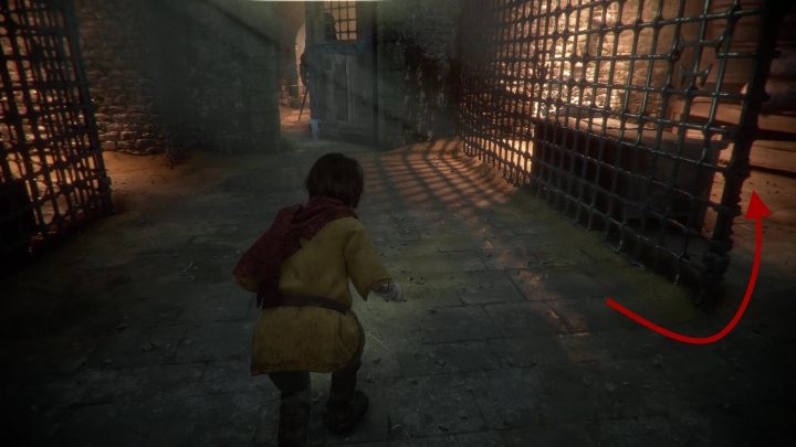 W ten sposób trafisz na korytarz, który prowadzi do celi - A Plague Tale Innocence: Więzy krwi - solucja, opis przejścia - A Plague Tale Innocence - poradnik do gry