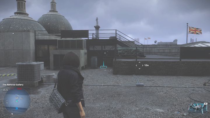 W bocznej uliczce obok budynku trafisz na ogrodzenie obwieszone transparentami - Watch Dogs Legion: Relikty - mapa City of Westminster, lokacje - Watch Dogs Legion - poradnik do gry