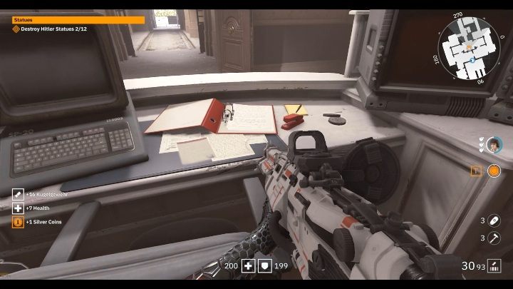 Na ogromnym biurku, pod czerwonym segregatorem leży notatka - Mały Berlin / Little Berlin | Sekrety w Wolfenstein Youngblood - Wolfenstein: Youngblood - poradnik do gry