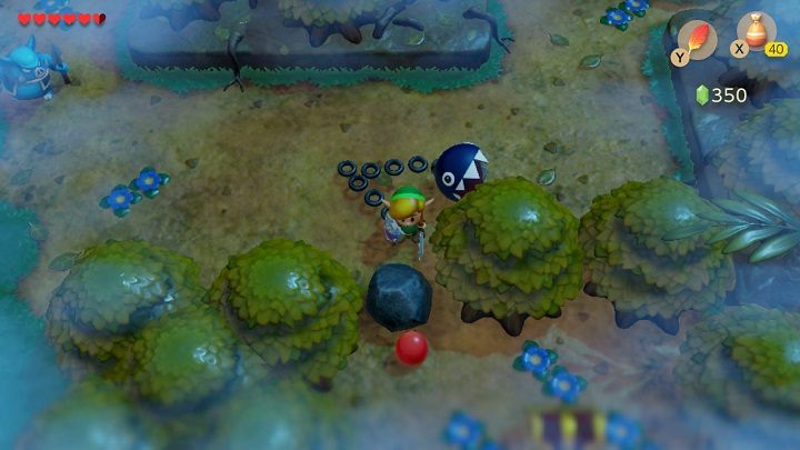 Zejdź na dół i usuń kamień pomiędzy drzewami, aby dostać się do skrzyni z Tajemną Muszlą - Key Cavern | Solucja The Legend of Zelda Links Awakening - The Legend of Zelda Links Awakening - poradnik do gry