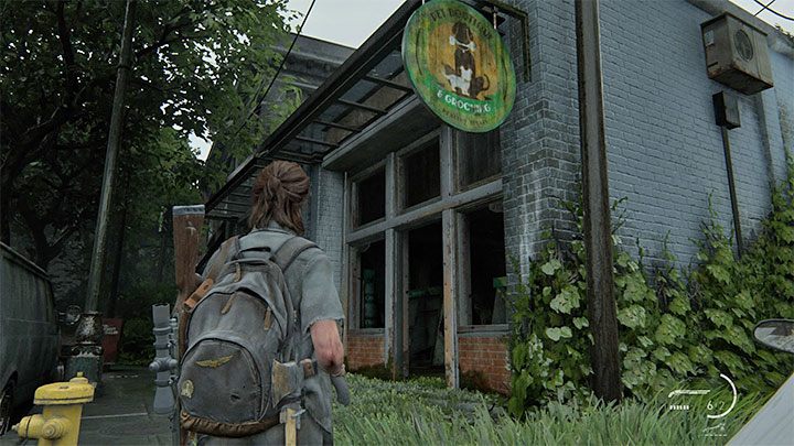 Powróć do głównej ulicy i zainteresuj się budynkiem Pet Boutique po przeciwnej stronie drogi - pokazaliśmy go na obrazku - The Last of Us 2: Seattle, dzień 2 Ellie - sejfy, kody - The Last of Us 2 - poradnik do gry