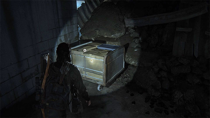Odszukaj teraz pokazany na obrazku wózek na kołach - The Last of Us 2: Seattle, dzień 3 Ellie - sejfy, kody - The Last of Us 2 - poradnik do gry