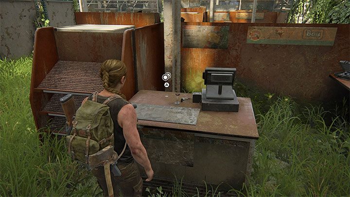 Moneta leży na ladzie obok jednej z kas - The Last of Us 2: Pieszo / On Foot sekrety, znajdźki - The Last of Us 2 - poradnik do gry