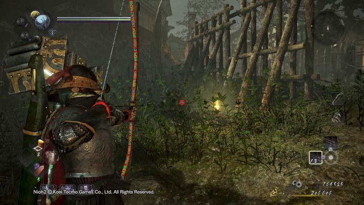 Po prawej stronie zaś, przy wieży strażniczej znajduje się przyczajony przeciwnik - NiOh 2: Dwie twarze gościnności, solucja - NiOh 2 - poradnik do gry