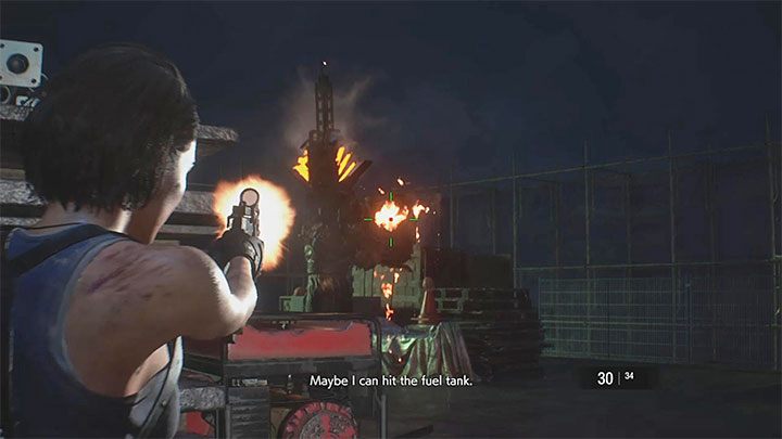 Kluczem do wygrania pierwszej części tej bitwy jest ostrzeliwanie zbiornika z paliwem na plecach Nemesisa - Resident Evil 3: Nemesis, miejsce rozbiórki - Resident Evil 3 - poradnik do gry