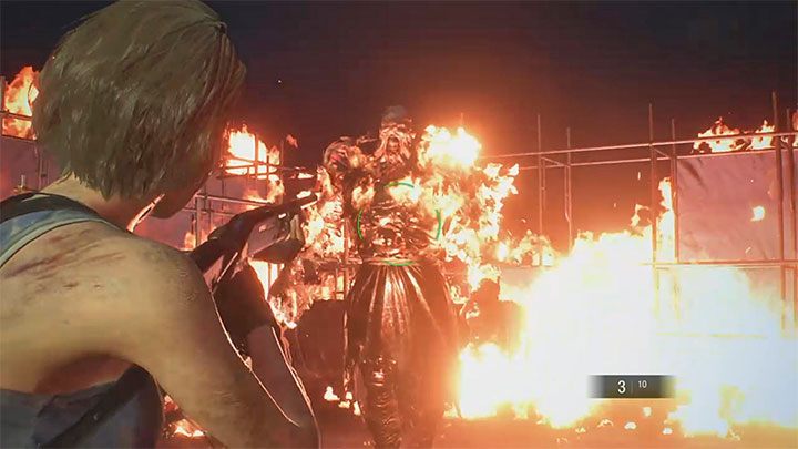 Po tym jak zbiornik paliwa zostanie zniszczony awansujesz do drugiej fazy walki - musisz atakować i jednocześnie unikać ataków chodzącego płonącego Nemesisa - Resident Evil 3: Nemesis, miejsce rozbiórki - Resident Evil 3 - poradnik do gry