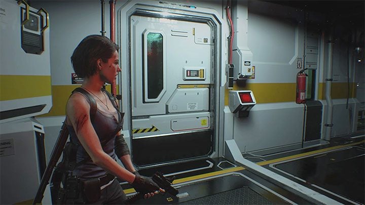 Z pendrivem powróc na poziom 1F i użyj go na zamku elektronicznym przy mijanych wcześniej zamkniętych drzwiach - Resident Evil 3: NEST 2, szczepionka solucja, opis przejścia - Resident Evil 3 - poradnik do gry