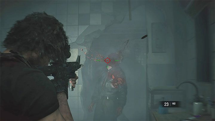 Powróć do pomieszczenia Shower Room, wejdź w interakcję z osłabioną ścianą i przyczep do niej detonator - Resident Evil 3: Komisariat policji solucja, opis przejścia - Resident Evil 3 - poradnik do gry