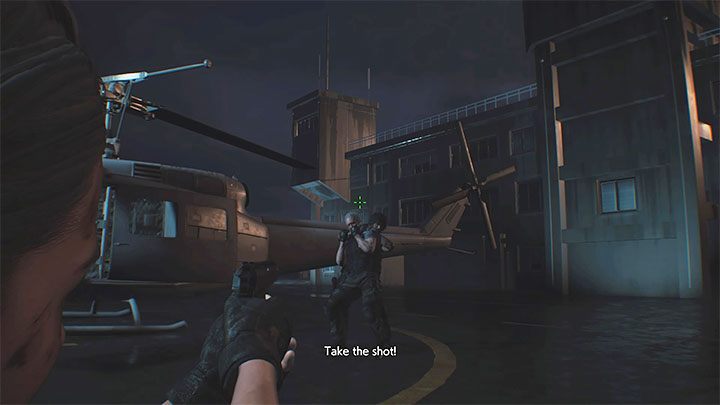 Po obejrzeniu cut-scenki musisz wykonać ostatnią akcję - strzelić w Nicholaia unikając przy tym trafienia Carlosa - Resident Evil 3: Finał, Nemesis solucja, opis przejścia - Resident Evil 3 - poradnik do gry