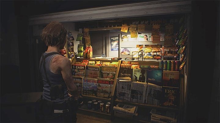 Gazeta leży na ladzie kiosku Newsstand znajdującego się na terenie stacji metra Redstone Street Station - Resident Evil 3: Stacja metra Redstone sekrety, znajdźki - Resident Evil 3 - poradnik do gry