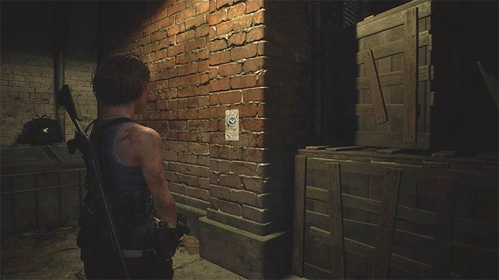 Notatka wisi na ścianie w alejce badanej po przejściu przez garaż Garage - Resident Evil 3: Śródmieście sekrety, znajdźki - Resident Evil 3 - poradnik do gry