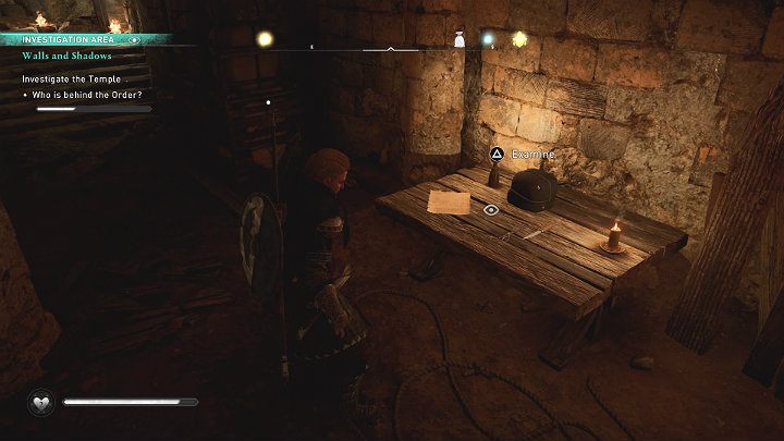 Kolejną wskazówką są narzędzia chirurgiczne leżące na drewnianym stole - takie same, jakie Eivorowi udało się znaleźć na miejscu zbrodni oraz list o planowanej zapłacie dla kowala - Assassins Creed Valhalla: Mury i cienie/Walls and Shadows - solucja - Assassins Creed Valhalla - poradnik do gry