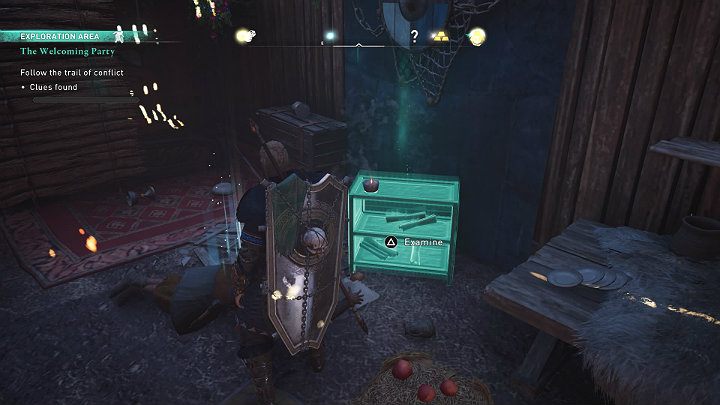 Pierwszą wskazówką jest mały stolik z rozrzuconymi zwojami - Assassins Creed Valhalla: Gorące powitanie/The Welcoming Party - solucja - Assassins Creed Valhalla - poradnik do gry