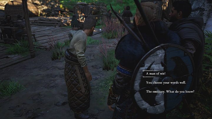 Mężczyzna w szarym ubraniu stojący na zewnątrz karczmy wyjawi Ci dodatkowe informacje całkowicie za darmo, jeśli tylko trochę go pochwalisz - Assassins Creed Valhalla: Gambit opata/The Abbots Gambit - solucja - Assassins Creed Valhalla - poradnik do gry