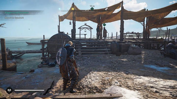 Udaj się na spotkanie z opatem i przekaż mu wiadomość - spotkasz go w porcie, w towarzystwie Basima - Assassins Creed Valhalla: Marionetki i więźniowie - solucja, opis przejścia - Assassins Creed Valhalla - poradnik do gry