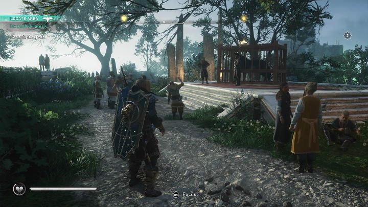 Gdy zjawisz się w Asgardzie, spotkasz Lokiego i Tyra, którzy zachwycają się wielkością schwytanego w klatkę wilka - Assassins Creed Valhalla: Przyjęcie do rodziny/Extended Family - solucja - Assassins Creed Valhalla - poradnik do gry