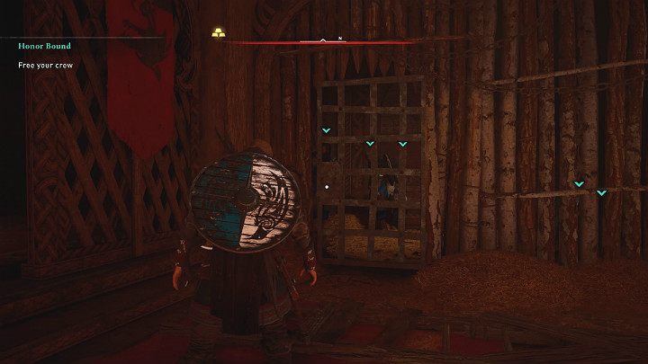 Po walce z Rikiwulfem uwolnij pierwszego wikinga z więzów, a resztę swoich towarzyszy wypuść z klatki - Assassins Creed Valhalla: Więzy Krwi/Honor Bound - solucja, opis przejścia - Assassins Creed Valhalla - poradnik do gry