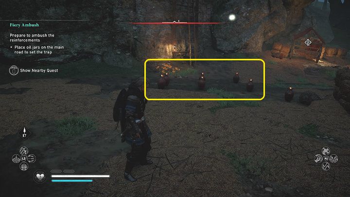 Ustaw czerwone dzbany z oliwą na głównym trakcie w miejscu zaznaczonym na powyższym obrazku, aby zastawić pułapkę na nadciągających żołnierzy i wyrządzić jak największe obrażenia - Assassins Creed Valhalla: Ognista zasadzka/Fiery Ambush - solucja - Assassins Creed Valhalla - poradnik do gry