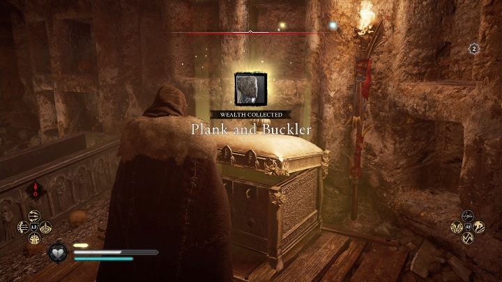 W środku od razu zauważysz złotą skrzynię, która zawiera ciężką tarczę - Assassins Creed Valhalla: Wyposażenie - Wschodnia Anglia, sekrety, lokacje - Assassins Creed Valhalla - poradnik do gry